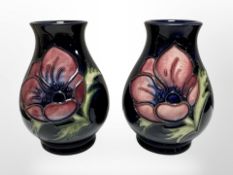A pair of miniature Moorcroft bulbous vases, height 10cm.