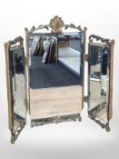 A painted and gilt triptych mirror,