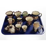 A group of Royal Doulton miniature character jugs, Beswick figure of Siamese cats, etc.