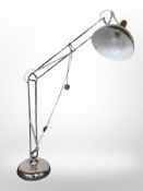 A contemporary chrome angle poise standard lamp