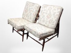 A pair of Ercol chairs in floral upholstery