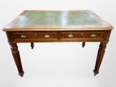 A Victorian mahogany library table fitted two drawers with green tooled leather inset panel,