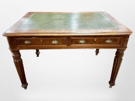 A Victorian mahogany library table fitted two drawers with green tooled leather inset panel,