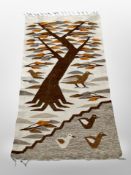 A 1970's flatweave rug depicting birds,