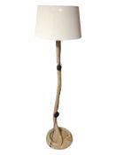 A contemporary pine and rope standard lamp