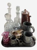 A group of crystal decanters, ruby glass vase, pewter tankards, silver-plated items.