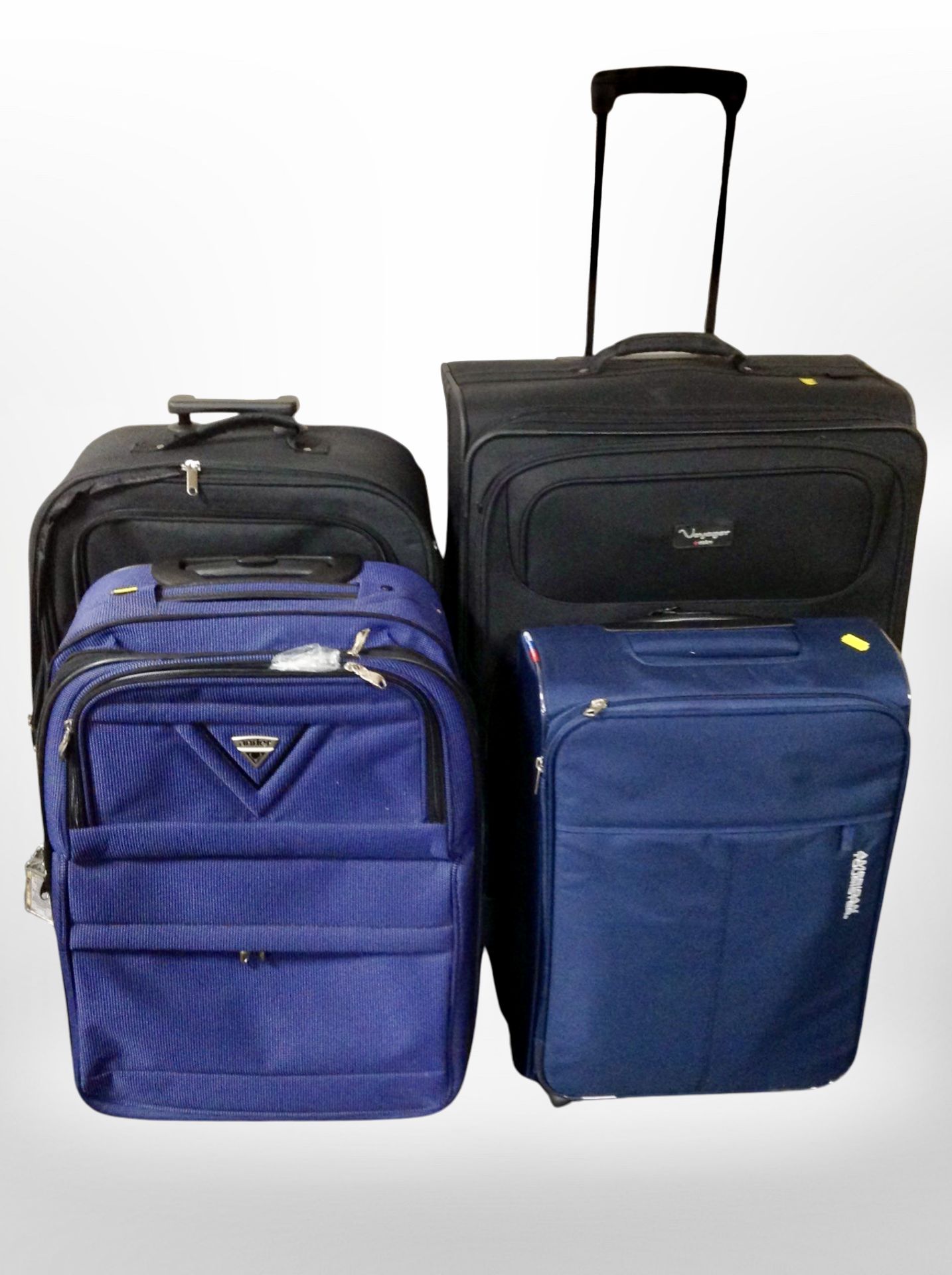 Four assorted luggage cases.