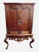 A Victorian style heavily carved hardwood cabinet,