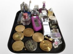 A group of compacts and assorted perfumes and fragrances.
