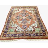 A 20th century woolen carpet of Persian design,