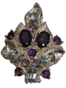 An African Lolite gemstone silver ring with topaz and amethyst