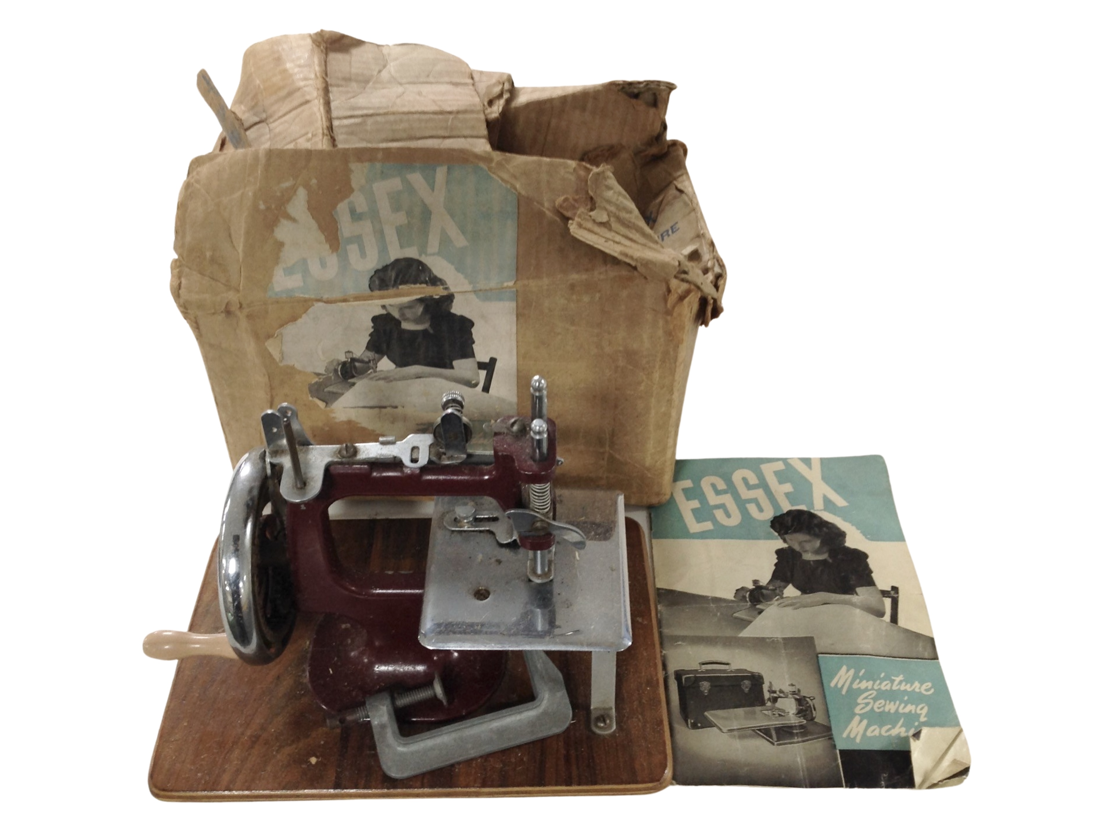 An Essex child's hand sewing machine in original box.