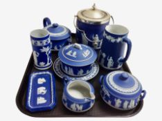 Eight pieces of Wedgwood blue and white Jasperware including biscuit jar with silver-plated lid,