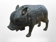 An antique bronze figure of a boar, probably Roman, length 9 cm, height 6 cm.