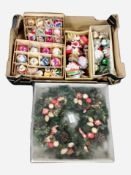 A box of Christmas baubles, door garland, etc.