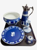 Five pieces of Wedgwood blue and white Jasperware including claret jug with silver-plated lid.