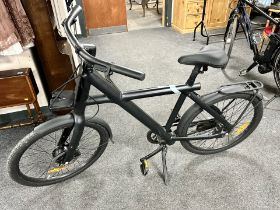 A Van Moof X3 e-bike, 19.5' frame with charger, Van Moof tool box and helmet.