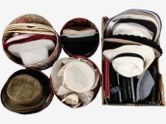 A collection of lady's hats and leather purses.