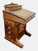 A Victorian rosewood and satinwood marquetry inlaid Davenport,