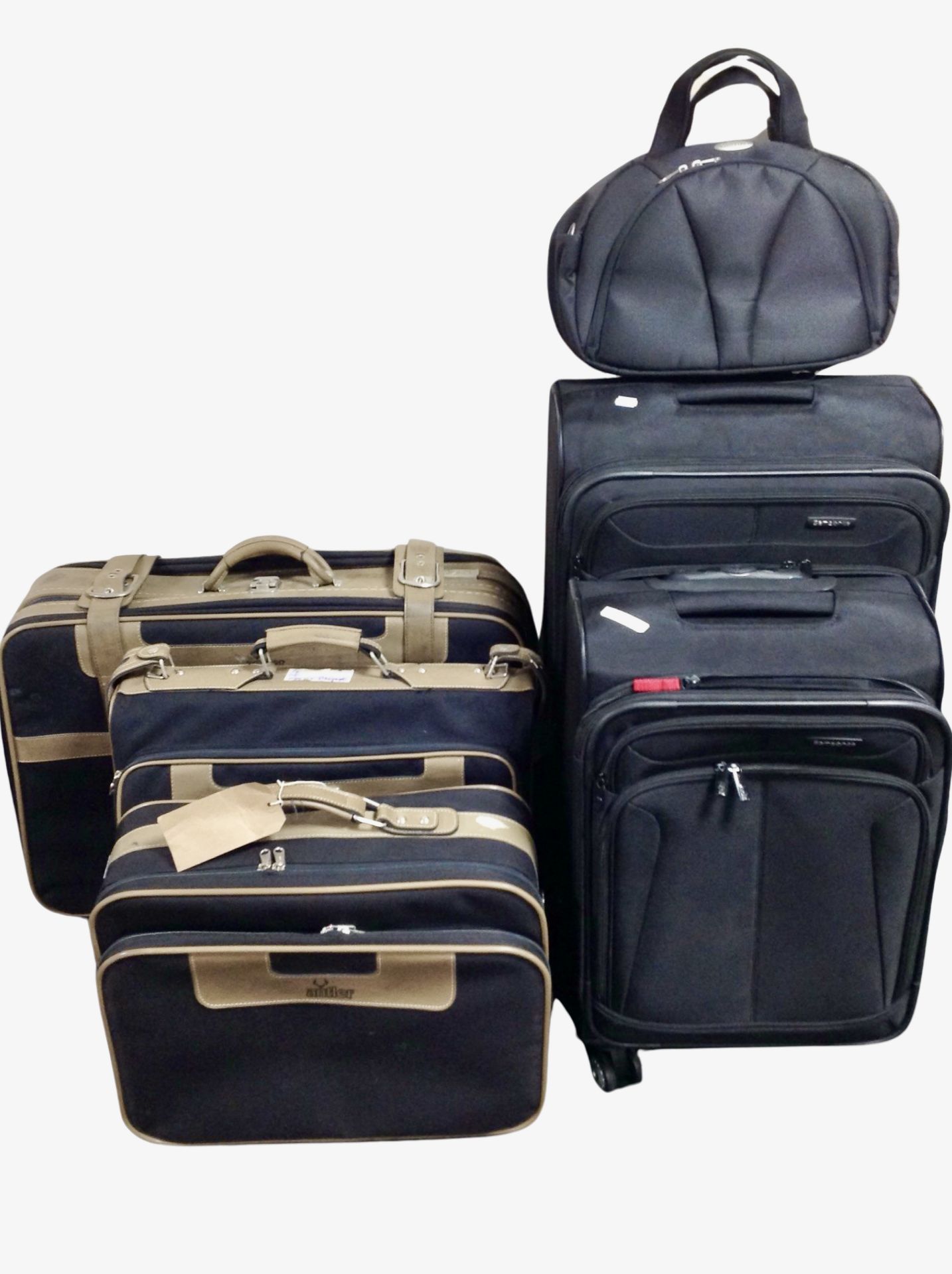 Six assorted luggage cases.