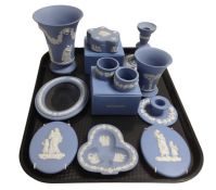 Eleven pieces of Wedgwood blue Jasperware including photo frame, vases, trinket boxes, candlesticks.