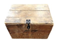 An antique pine crate on ball bearing feet with 'Heinz Cream of Tomato Soup' stencilled to side,