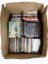 A box of mixed CDs and cassettes.