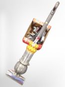 A Dyson DC50 upright vacuum cleaner and accessories.