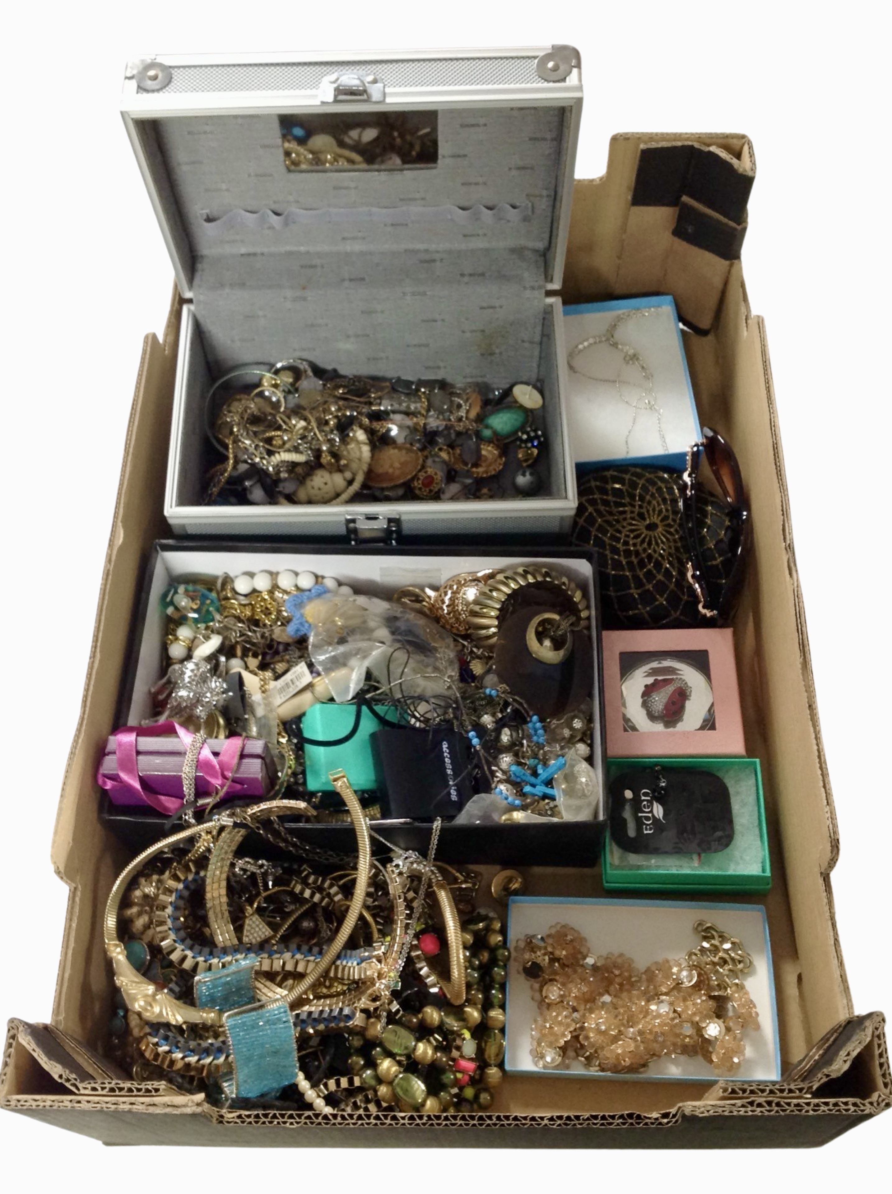 A box of assorted costume jewellery, sunglasses, necklaces, pendants, bangles, etc.