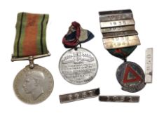A WWII Defence Medal, an Edward VIII coronation medal,