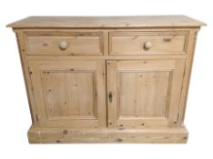 A contemporary pine farmhouse style sideboard,
