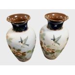 A pair of Aesthetic movement glazed earthenware baluster vases, height 35cm.
