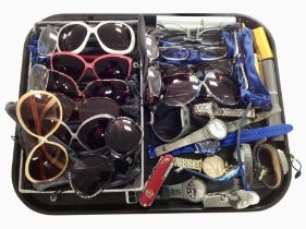 A collection of lady's and gent's costume wristwatches, sunglasses, a Swiss Army knife, etc.