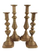 Two pairs of brass candlesticks, tallest 30cm.