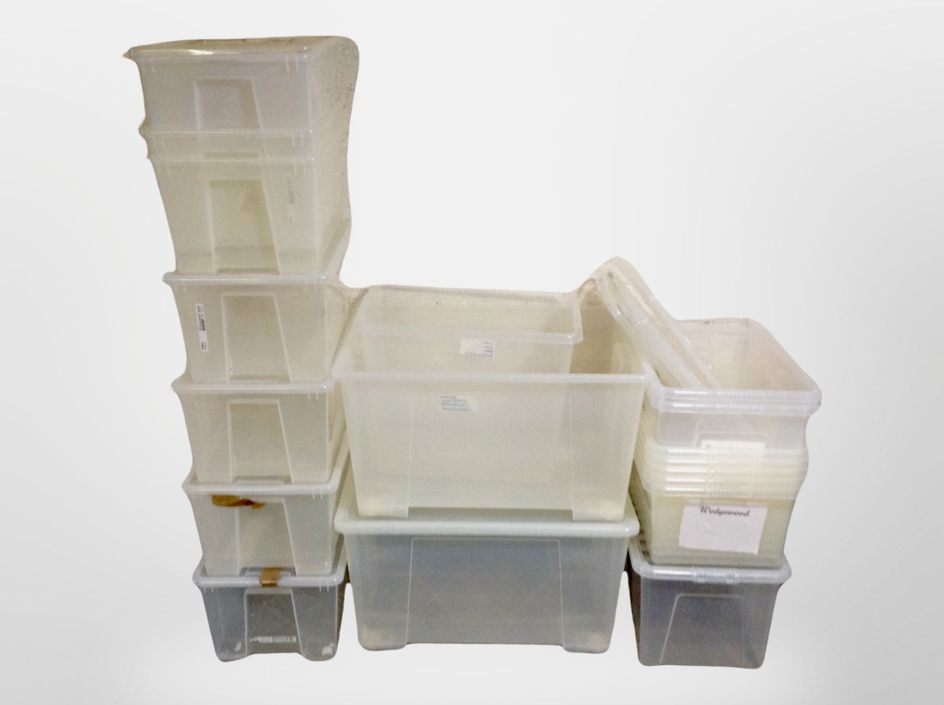 A quantity of plastic storage boxes