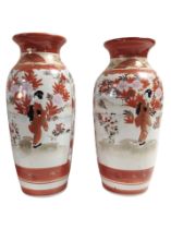A pair of Japanese Kutani porcelain vases, height 24cm (restored).