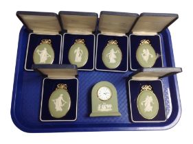 Six boxed Wedgwood green Jasperware cameos, and a similar mantel clock.