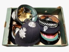 A group of reproduction Northumberland police constabulary hats.