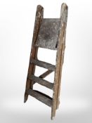 A vintage wooden folding step ladder,
