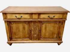 A carved hardwood Colonial style sideboard,
