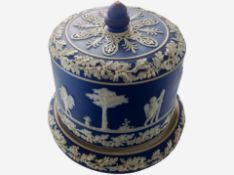 A Wedgwood blue and white Jasperware cheese dish and cover, height 24cm.