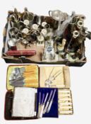 A box containing assorted cutlery, golf trophies, pewter tankards, table candelabra, etc.