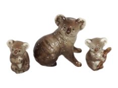 Three Beswick figures of koala bears, tallest 9cm.