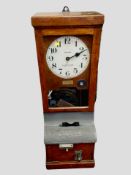 A North East Time Recorders Limited clocking-in machine, height 98cm.