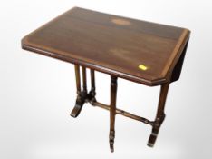 A Victorian mahogany satinwood inlaid drop leaf Sutherland table,