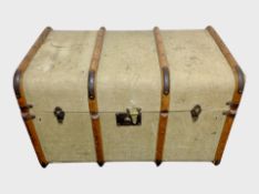 An early 20th century canvas and bentwood shipping trunk,