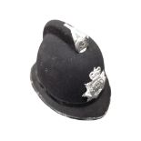 A reproduction Northumbria police helmet.