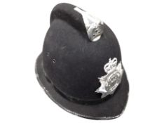 A reproduction Northumbria police helmet.