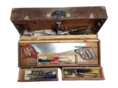 An antique joiner's tool box containing carpentry tools