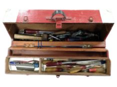 An antique joiner's tool box containing carpentry tools